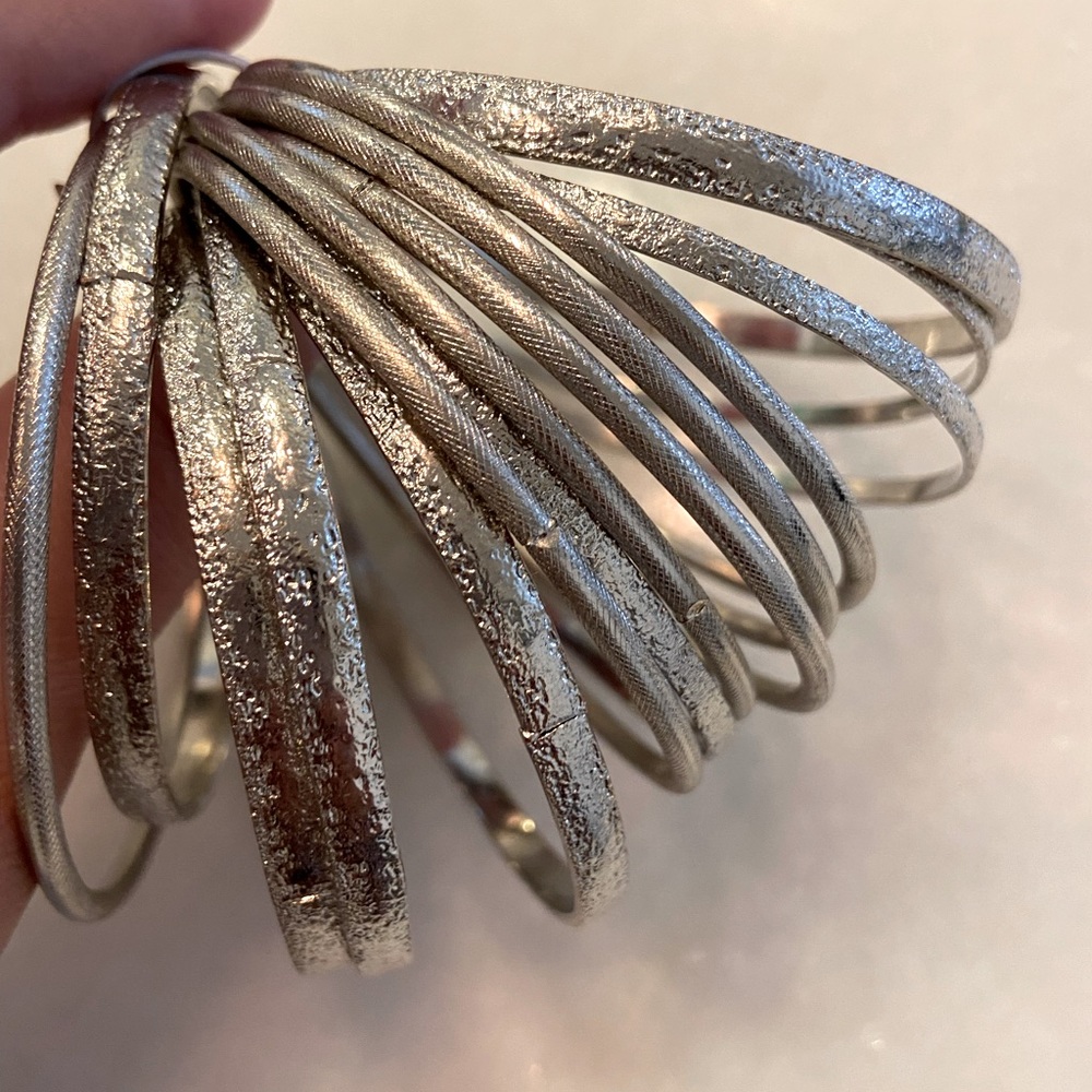 Set of 14 bangle bracelets (silver color)